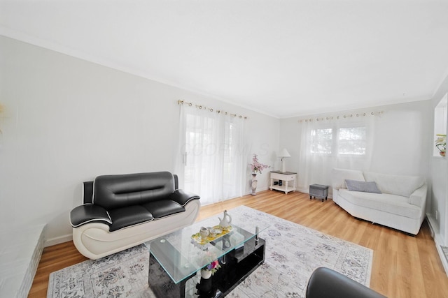 4861 Warminster Dr, Columbus, OH 43232 - living area featuring wood finished floors, crown molding, and baseboards