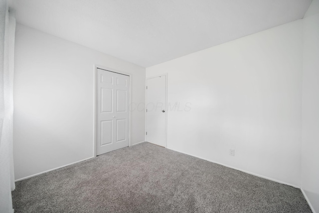 4861 Warminster Dr, Columbus, OH 43232 - unfurnished bedroom featuring carpet flooring and baseboards
