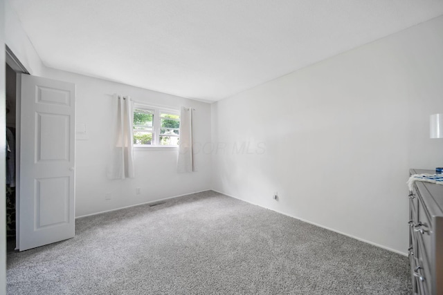 4861 Warminster Dr, Columbus, OH 43232 - unfurnished bedroom with carpet flooring and baseboards