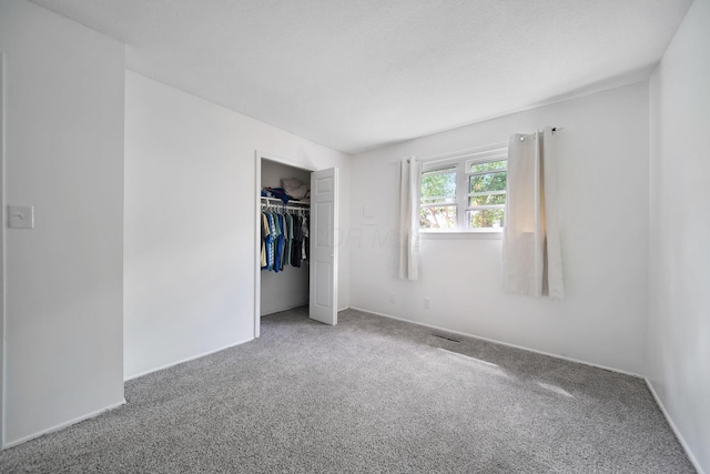 4861 Warminster Dr, Columbus, OH 43232 - unfurnished bedroom featuring carpet, a closet, and baseboards