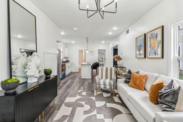 568 Wilson Ave, Marion, OH 43302 - living area with a chandelier, dark wood-style flooring, and recessed lighting
