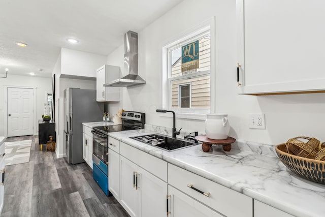 568 Wilson Ave, Marion, OH 43302 - kitchen featuring appliances with stainless steel finishes, wall chimney exhaust hood, a sink, white cabinetry, and light stone countertops