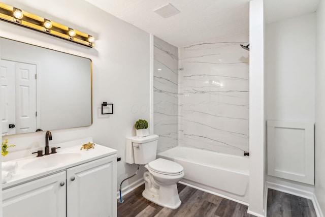 568 Wilson Ave, Marion, OH 43302 - bathroom featuring wood finished floors, toilet, vanity, and shower / bath combination