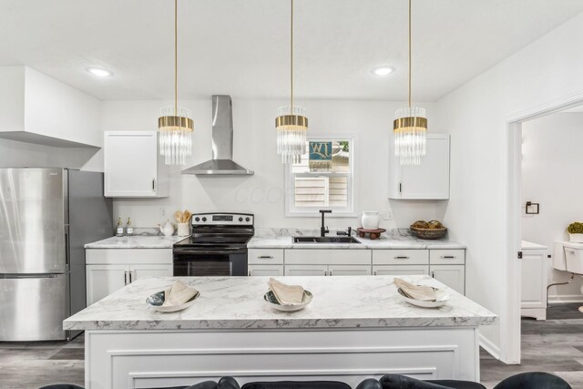 568 Wilson Ave, Marion, OH 43302 - kitchen featuring freestanding refrigerator, wall chimney exhaust hood, range with electric cooktop, a sink, and dark wood-style floors