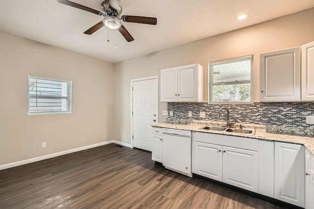 kitchen featuring dishwasher, a sink, tasteful backsplash, baseboards, and recessed lighting