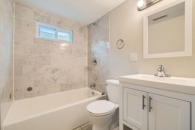 bathroom with toilet, vanity, and shower / bathtub combination