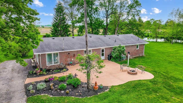 13742 State Rte 41, Jeffersonville, OH 43128 - rear view of house featuring a fire pit, brick siding, a patio, a lawn, and roof with shingles
