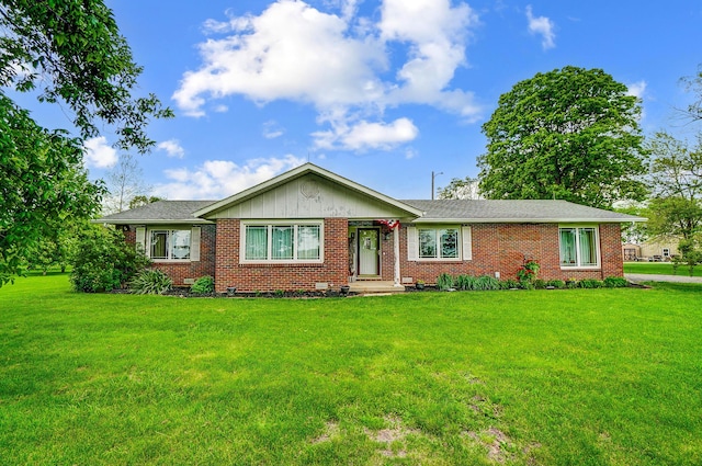 13742 State Rte 41, Jeffersonville, OH 43128 - ranch-style house featuring brick siding, a front lawn, and board and batten siding