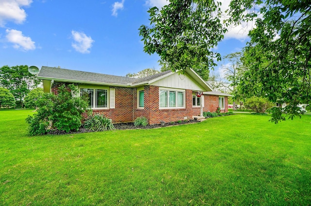 13742 State Rte 41, Jeffersonville, OH 43128 - view of front facade featuring brick siding, a front yard, and board and batten siding