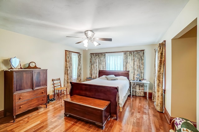 13742 State Rte 41, Jeffersonville, OH 43128 - bedroom with light wood-type flooring, a ceiling fan, and baseboards