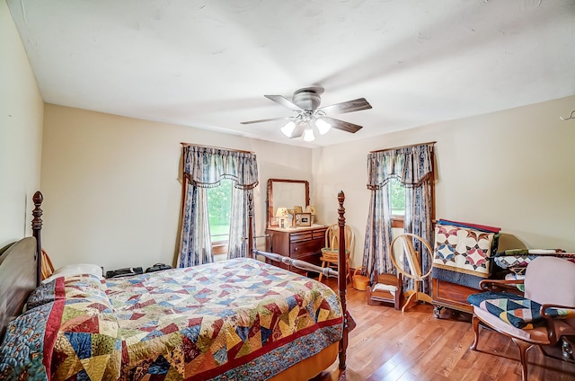 13742 State Rte 41, Jeffersonville, OH 43128 - bedroom with multiple windows, wood finished floors, and ceiling fan