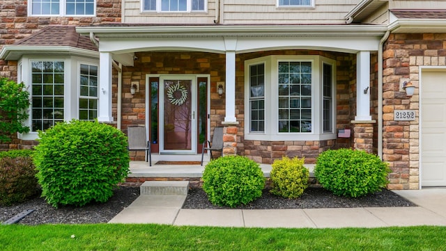 21252 Breckenridge Ln, Strongsville, OH 44149 - view of exterior entry with stone siding and a porch
