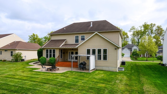 21252 Breckenridge Ln, Strongsville, OH 44149 - back of house with a patio area, a lawn, and roof with shingles