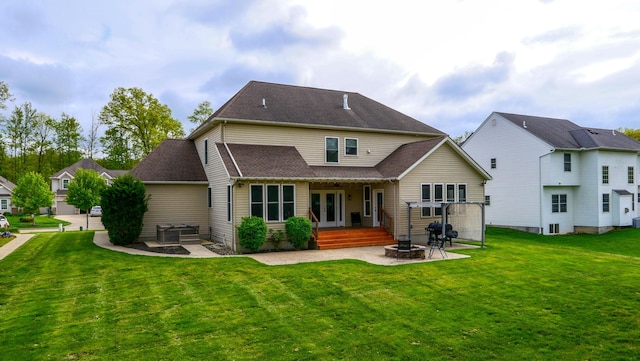21252 Breckenridge Ln, Strongsville, OH 44149 - back of property featuring french doors, a fire pit, a patio area, a yard, and a shingled roof