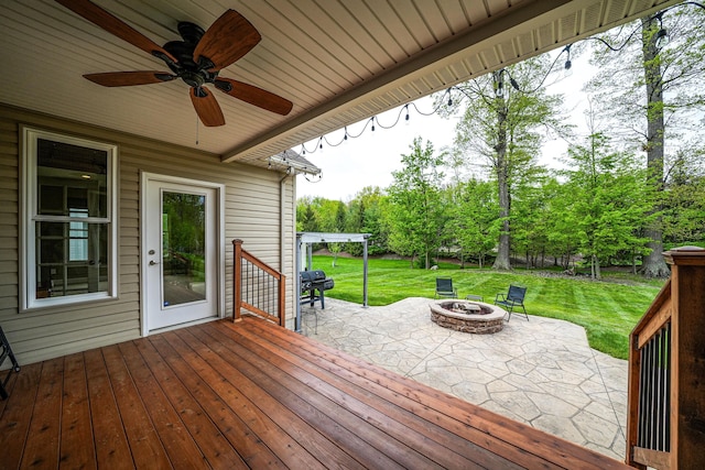 21252 Breckenridge Ln, Strongsville, OH 44149 - wooden terrace featuring an outdoor fire pit, a patio, a yard, and ceiling fan