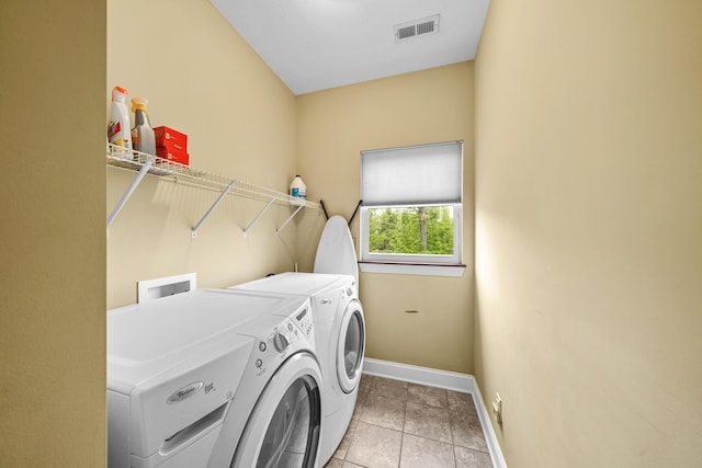 21252 Breckenridge Ln, Strongsville, OH 44149 - laundry room with washing machine and clothes dryer, baseboards, and light tile patterned floors