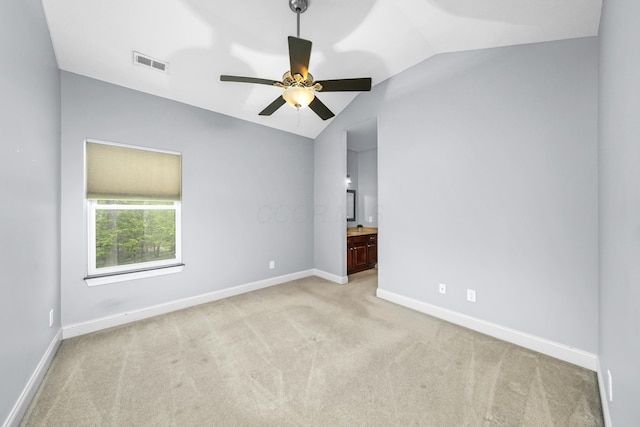 21252 Breckenridge Ln, Strongsville, OH 44149 - spare room with vaulted ceiling, carpet floors, ceiling fan, and baseboards