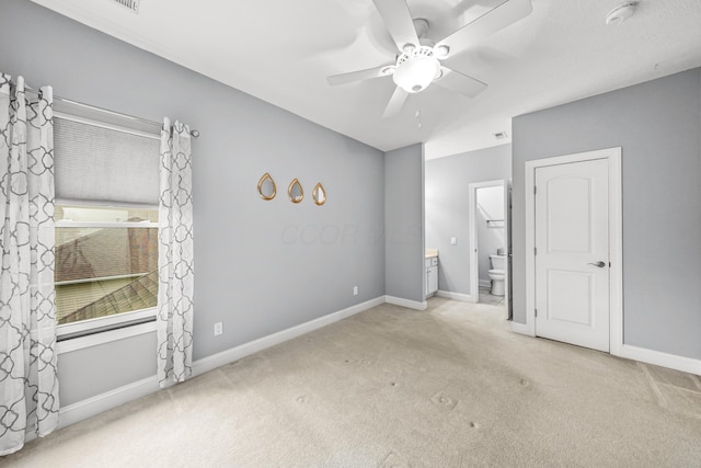 21252 Breckenridge Ln, Strongsville, OH 44149 - unfurnished bedroom featuring carpet floors, ensuite bathroom, baseboards, and ceiling fan