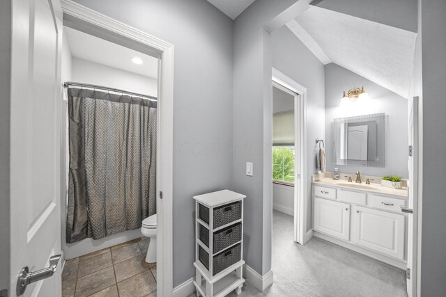 21252 Breckenridge Ln, Strongsville, OH 44149 - bathroom featuring vanity, toilet, vaulted ceiling, and baseboards
