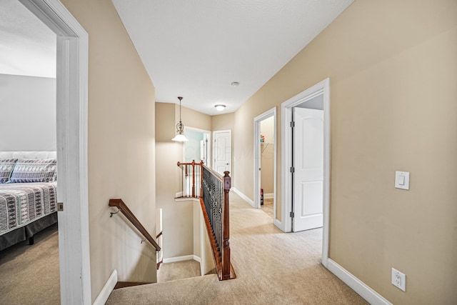 21252 Breckenridge Ln, Strongsville, OH 44149 - corridor featuring an upstairs landing, carpet floors, and baseboards