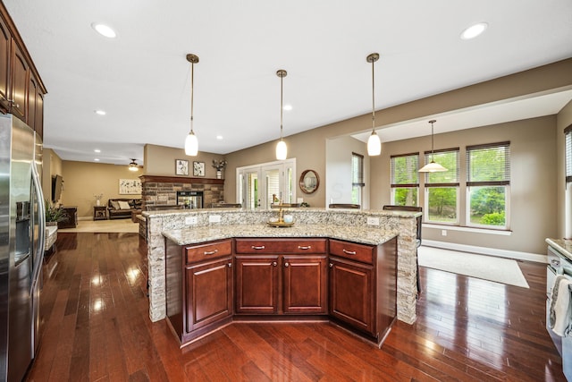 21252 Breckenridge Ln, Strongsville, OH 44149 - kitchen with stainless steel refrigerator with ice dispenser, open floor plan, dark wood-style floors, hanging light fixtures, and recessed lighting