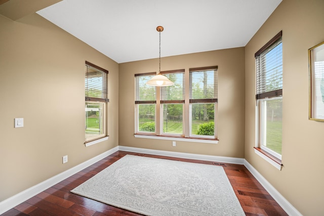 21252 Breckenridge Ln, Strongsville, OH 44149 - unfurnished dining area with dark wood-style floors and baseboards