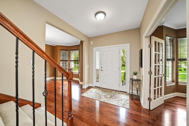 21252 Breckenridge Ln, Strongsville, OH 44149 - foyer with stairway, wood-type flooring, baseboards, and crown molding
