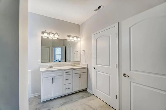 12281 Rooster Tail Dr, Pickerington, OH 43147 - bathroom featuring double vanity and baseboards
