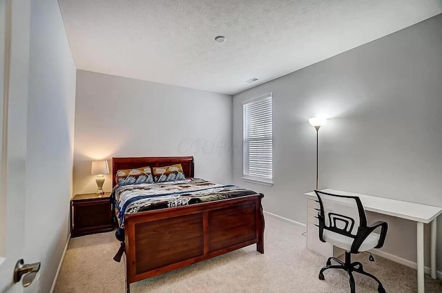 12281 Rooster Tail Dr, Pickerington, OH 43147 - carpeted bedroom with baseboards, a textured ceiling, and a desk