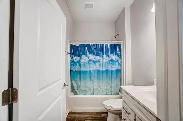 12281 Rooster Tail Dr, Pickerington, OH 43147 - bathroom featuring shower / bath combo with shower curtain, wood finished floors, vanity, and toilet