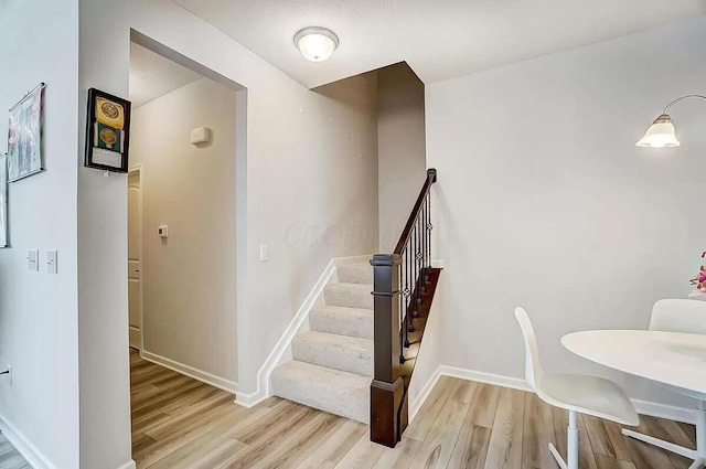 12281 Rooster Tail Dr, Pickerington, OH 43147 - staircase with wood finished floors and baseboards