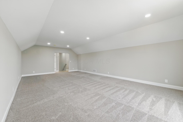 bonus room featuring vaulted ceiling, recessed lighting, baseboards, and carpet flooring