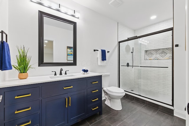 full bath featuring toilet, vanity, and a stall shower