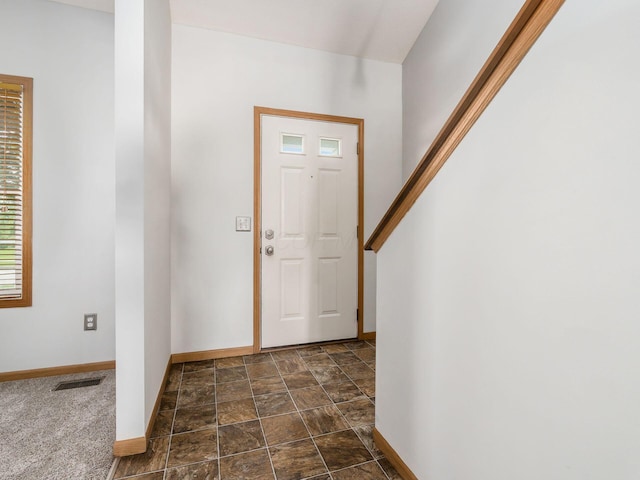 5292 Winters Run Rd, Dublin, OH 43016 - entryway with baseboards and stone finish floors