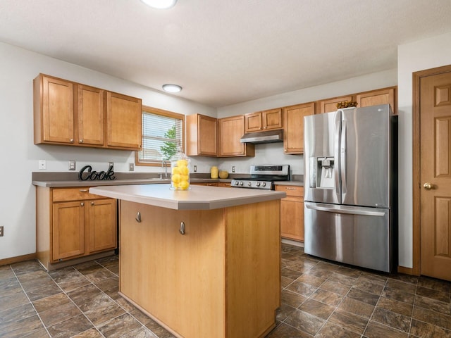 5292 Winters Run Rd, Dublin, OH 43016 - kitchen featuring appliances with stainless steel finishes, under cabinet range hood, a center island, and dark stone finish flooring