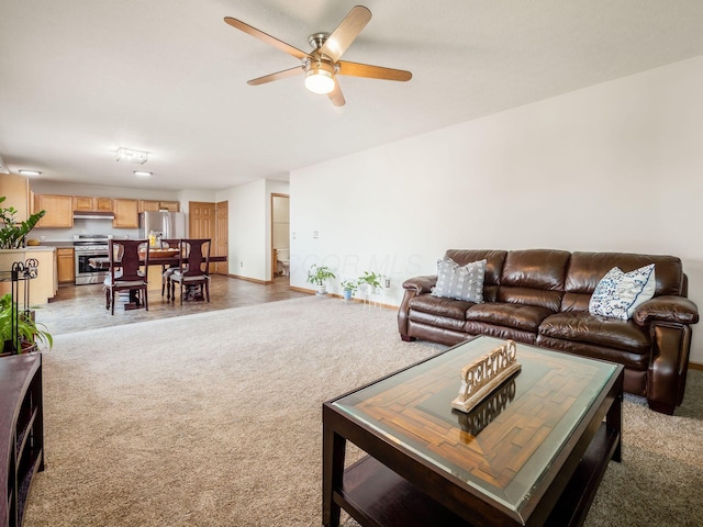 5292 Winters Run Rd, Dublin, OH 43016 - living room with light carpet, ceiling fan, and baseboards