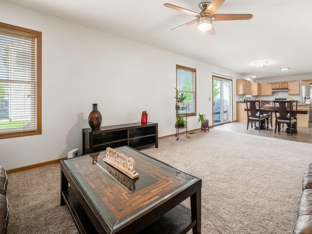 5292 Winters Run Rd, Dublin, OH 43016 - living room with ceiling fan, light colored carpet, and baseboards