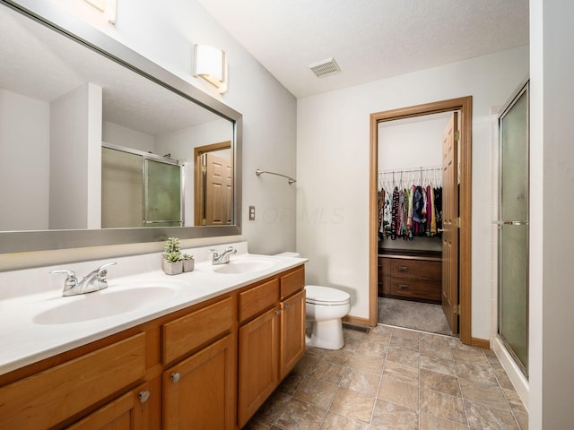 5292 Winters Run Rd, Dublin, OH 43016 - full bathroom with a shower stall, baseboards, double vanity, toilet, and stone finish flooring