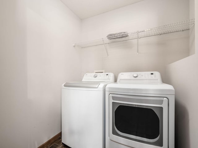 5292 Winters Run Rd, Dublin, OH 43016 - washroom featuring independent washer and dryer and dark wood finished floors