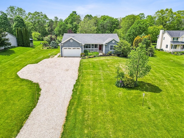 4217 Caswell Rd, Johnstown, OH 43031 - view of front facade with driveway, an attached garage, and a front lawn