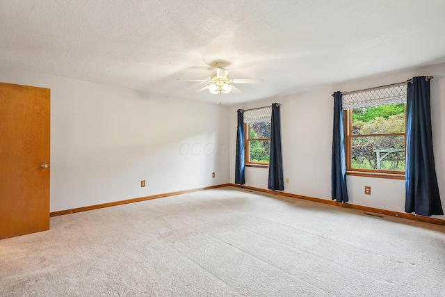 4217 Caswell Rd, Johnstown, OH 43031 - empty room featuring light colored carpet, plenty of natural light, a ceiling fan, and baseboards