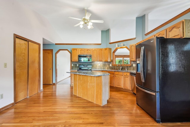 4217 Caswell Rd, Johnstown, OH 43031 - kitchen with stainless steel appliances, a center island, ceiling fan, backsplash, and high vaulted ceiling
