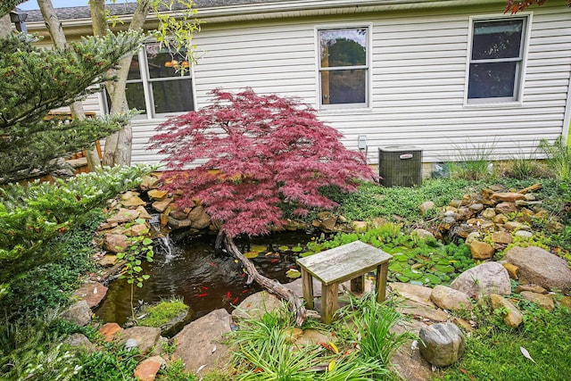 4217 Caswell Rd, Johnstown, OH 43031 - view of yard featuring cooling unit and a garden pond