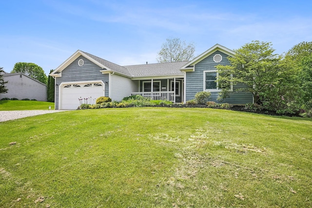 4217 Caswell Rd, Johnstown, OH 43031 - ranch-style house with a porch, an attached garage, driveway, and a front lawn