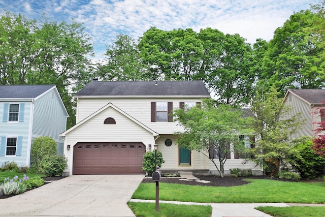 587 Center Woods Dr, Columbus, OH 43214 - view of front of house with concrete driveway and a front lawn