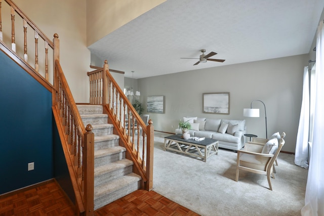 587 Center Woods Dr, Columbus, OH 43214 - living room featuring ceiling fan, stairs, and baseboards