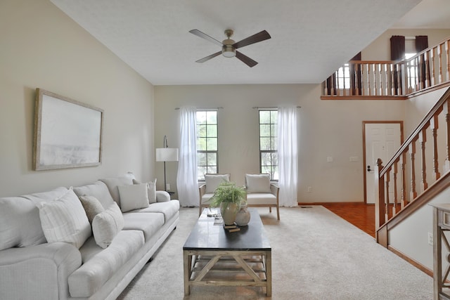 587 Center Woods Dr, Columbus, OH 43214 - living area with ceiling fan, carpet floors, stairs, and baseboards
