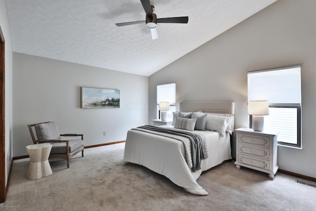 587 Center Woods Dr, Columbus, OH 43214 - carpeted bedroom with baseboards, vaulted ceiling, a textured ceiling, and a ceiling fan