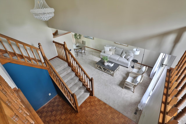 587 Center Woods Dr, Columbus, OH 43214 - living area featuring a chandelier, baseboards, and stairway