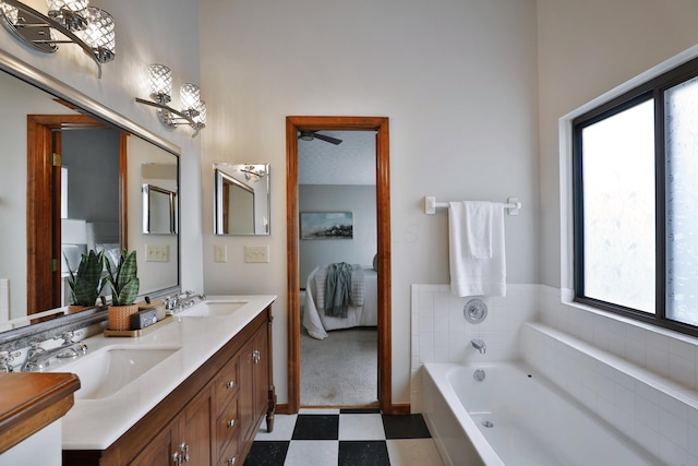 587 Center Woods Dr, Columbus, OH 43214 - full bath featuring ensuite bath, tile patterned floors, a garden tub, and double vanity